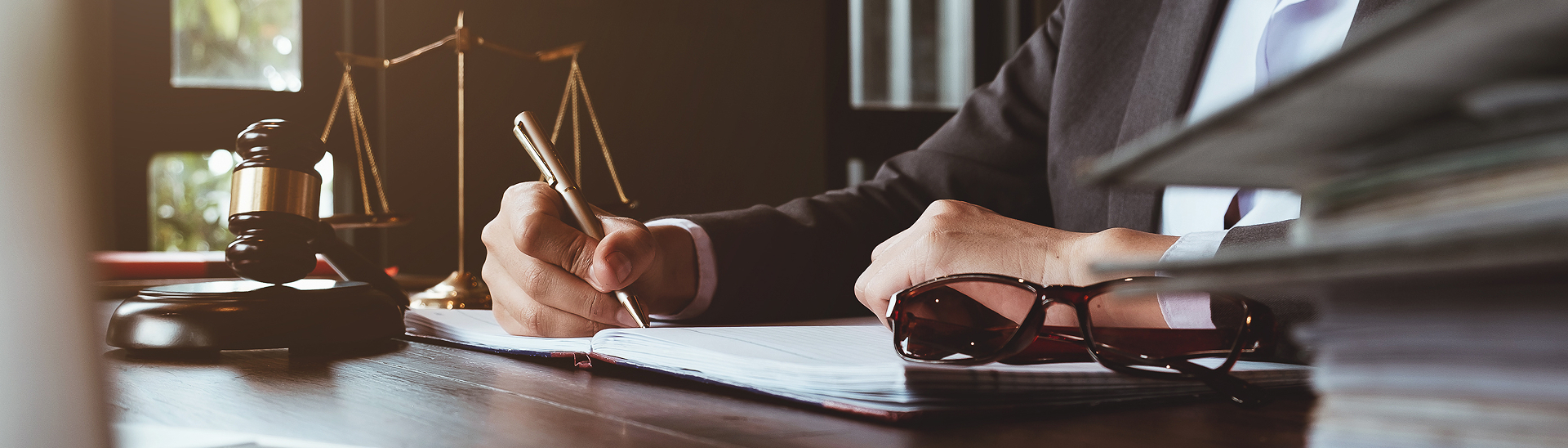 lawyer signing on paper